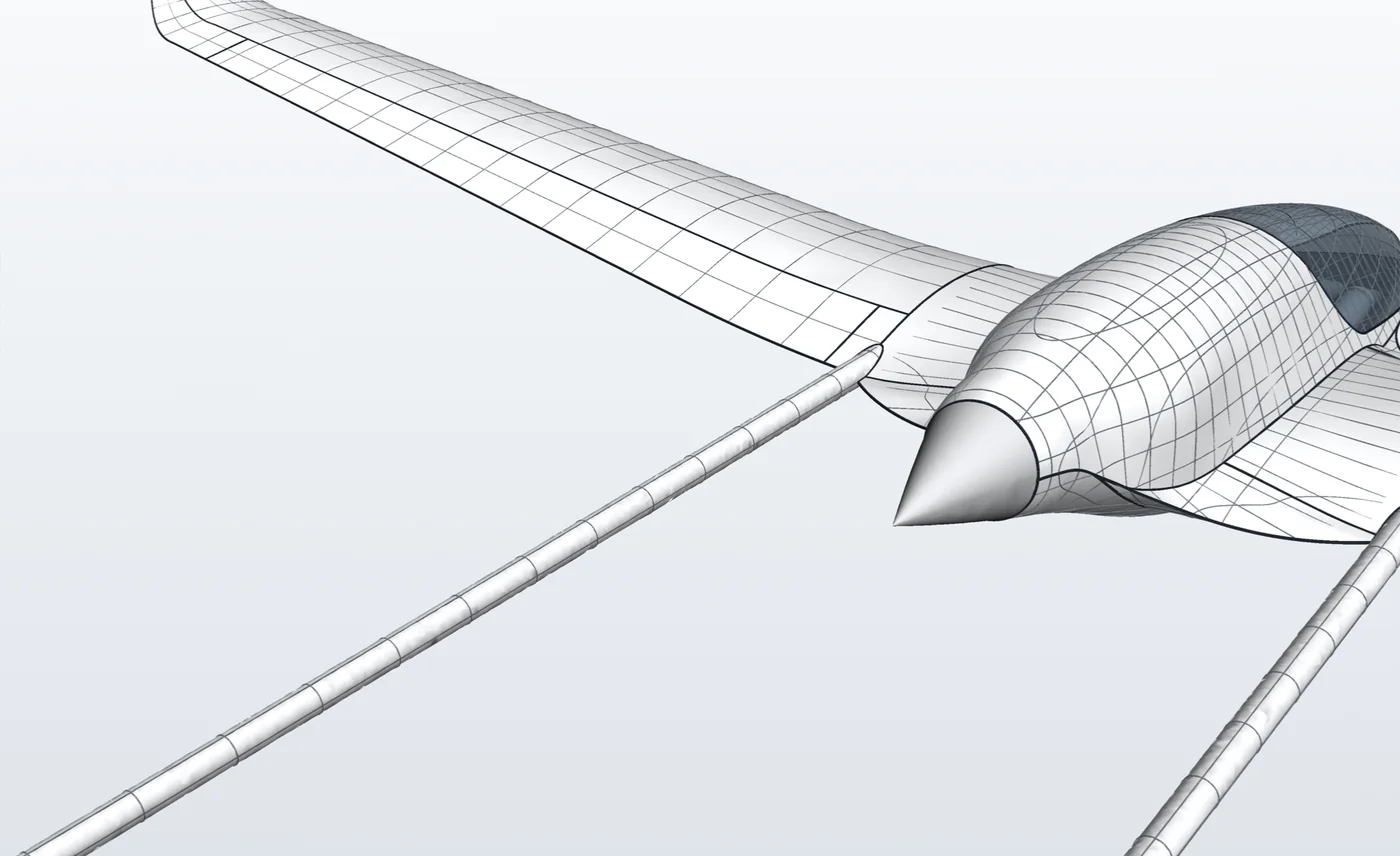 Close view of the wing root blending into the pod chine, with the propeller area behind.
